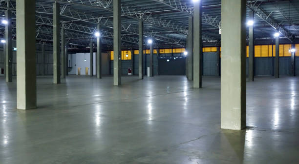 istock an empty industrial warehouse with large, clean windows, atmospheric light, white. 2205049480