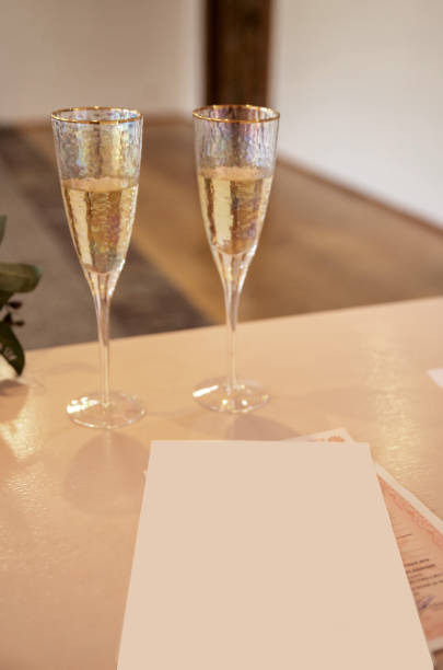 istock Marriage license with two champagne glasses 2205053871