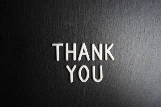 istock Thank you text on black background. Top view. Copy space. 2205054991