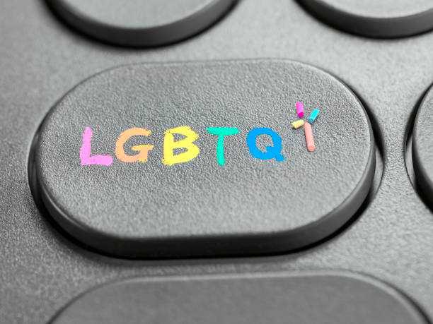 LGBTQ+ drawn with colored chalk on a computer key as a symbol of identity