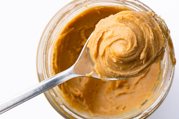 istock Delicious and healthy peanut butter on white background 2205063232