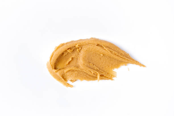 istock Delicious and healthy peanut butter on white background 2205063334