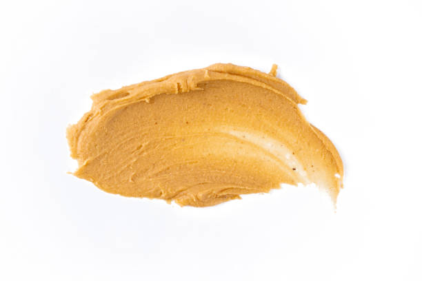 istock Delicious and healthy peanut butter on white background 2205063342
