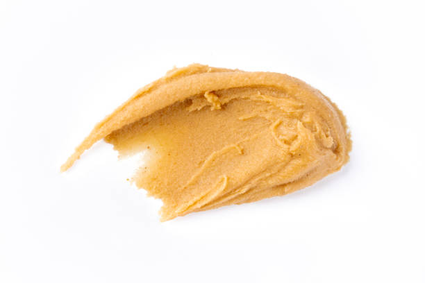 istock Delicious and healthy peanut butter on white background 2205063348