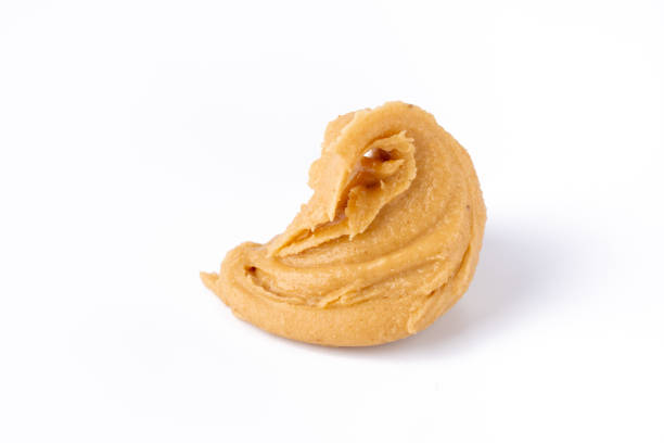 istock Delicious and healthy peanut butter on white background 2205063366