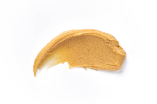 istock Delicious and healthy peanut butter on white background 2205063381