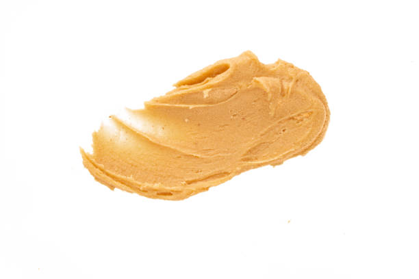 istock Delicious and healthy peanut butter on white background 2205063403