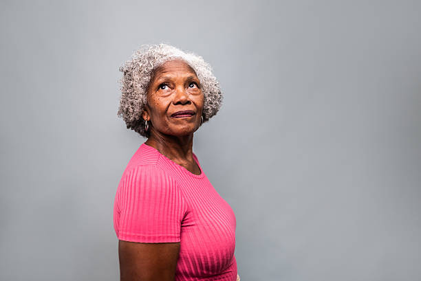 istock Thoughtful Senior Woman Looking Up with a Curious Expression 2205063737