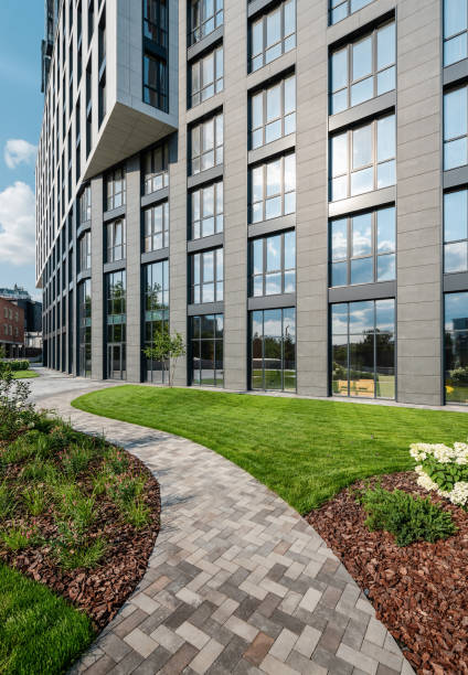 istock Path in a garden near modern office building. 2205067971