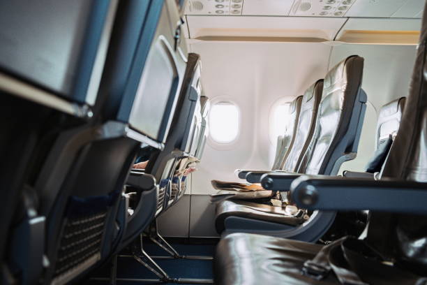 istock Empty seat row aboard commercial airplane, no people 2205068402