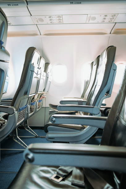 istock Empty seat row aboard commercial airplane, no people 2205068406