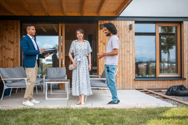 istock Diverse Couple in Discussion with Hispanic real estate agent 2205068602