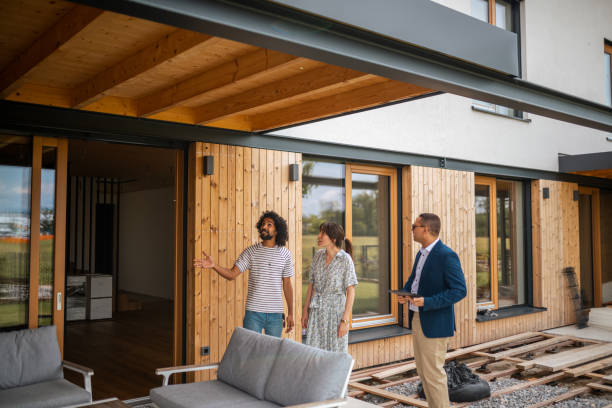 istock Diverse Couple Tours New Home with Hispanic Agent 2205068620