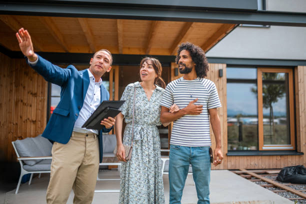 istock Diverse Couple on Home Tour with Hispanic Agent 2205068626