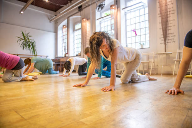 istock Group of people doing relaxation exercises 2205069482