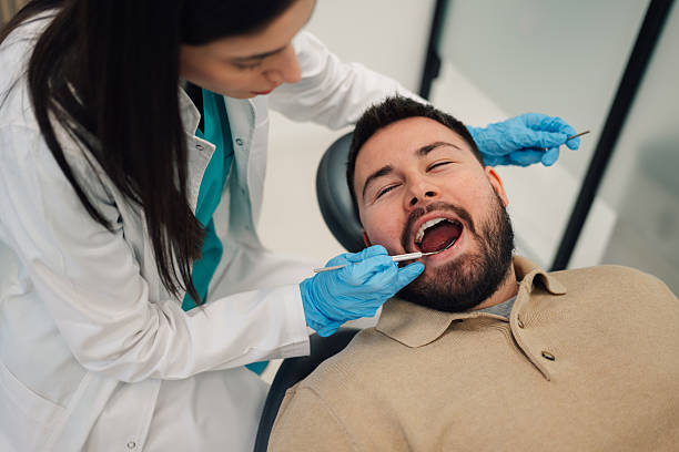 istock Dentist examining patient's teeth in dental clinic 2205072443