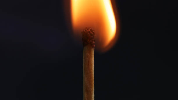 istock Burning matchstick in dark, representing life 2205075805