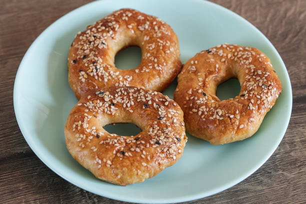 istock Quick bagels on a wooden background, top view 2205075955