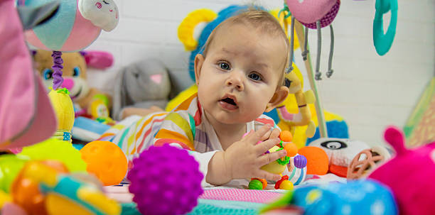 istock Baby playing on a toy mat. Child with an educational toy. Early development 2205078008