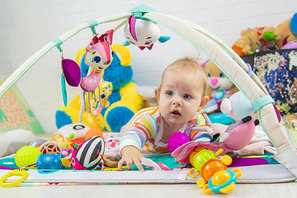 istock Baby playing on a toy mat. Child with an educational toy. Early development 2205078088