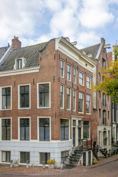 Netherlands. Summer day in Amsterdam. Facades of typical buildings at the intersection of streets in the central part of the city