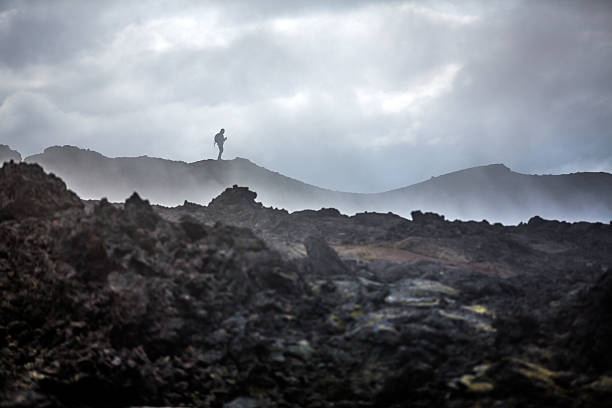 istock Person standing on volcanic area in Iceland 2205083553