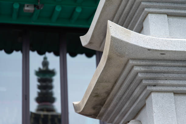 A detailed view of an ornate Chinese temple roof against a clear sky, showcasing intricate designs and vibrant colors. The main scene is focused on the architectural details of the temple's roof, which reflects traditional craftsmanship and cultural heritage. The visual style is rich and colorful, evoking a sense of historical significance and tranquility. This image could be used for educational purposes, cultural studies, or as inspiration for design projects.