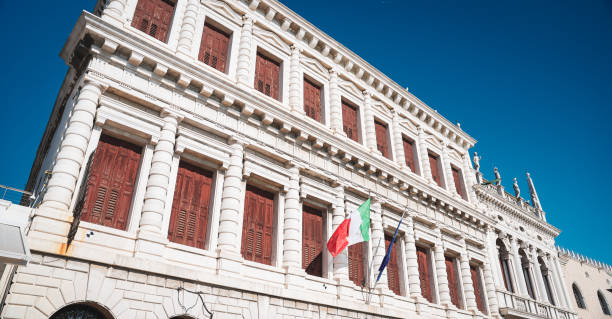 istock Historic building with flags in sunny Venice, showcasing architectural beauty 2205086311