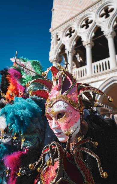 istock Masqueraders celebrate during Carnival festivities in Venice under clear skies 2205086438