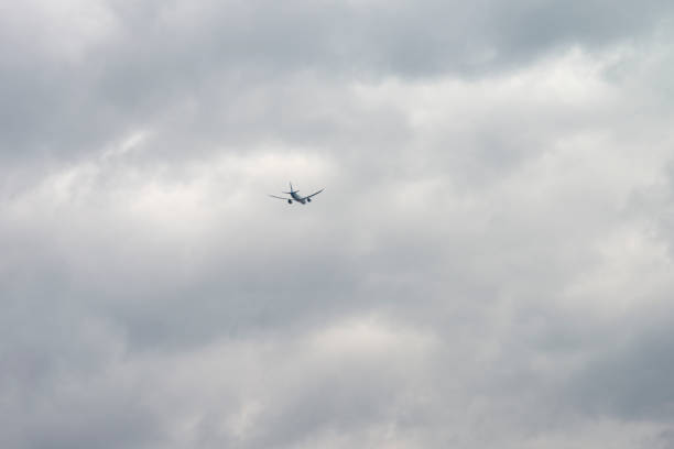 istock airplane on the sea in the cloudy sky 2205086636