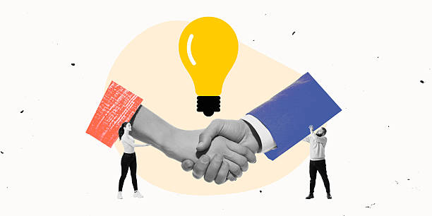 istock Handshake beneath symbolic lightbulb, representing trust, partnership, and business collaboration. Synergy in teamwork 2205087050
