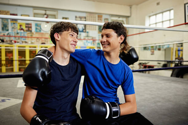 istock Sparring partners: young fighters and friends 2205088045