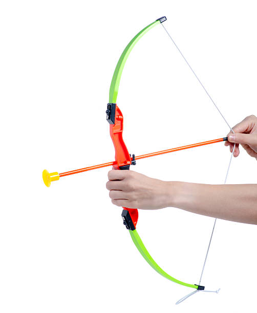 Children's toy bow and arrow in hand on white background isolation