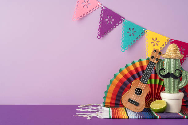 istock Festive arrangement featuring a cactus, ukulele, lime, and colorful decorations for a Mexican celebration 2205091874