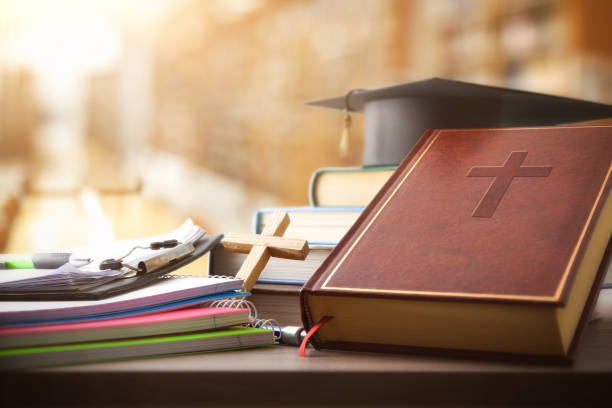 istock Bible books and supplies for Catholic education in a library 2205092927