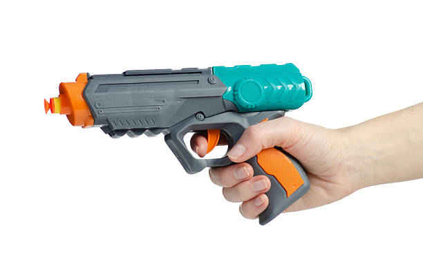 istock Children's toy gun with soft bullets sucker in hand 2205093291
