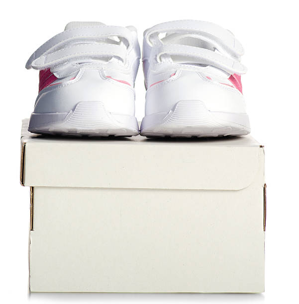 White kids sneakers shoelace with white box on white background isolation