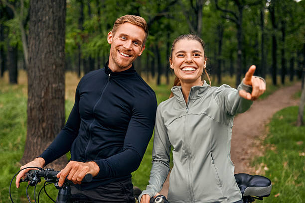 istock Happy Cyclists Riding Joyfully Through Beautiful Nature and Enjoying the Fresh Air 2205094548