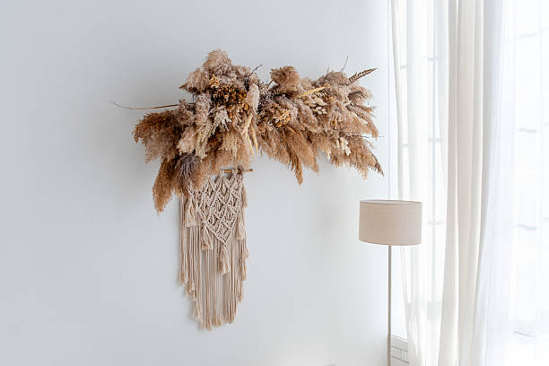 Dried flowers and macrame wall hanging creating cozy bohemian interior