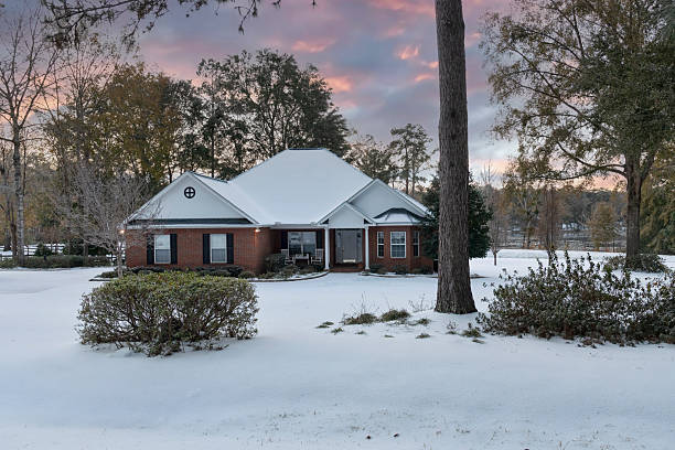 istock North Florida House with Snowy Landscape 2205097728