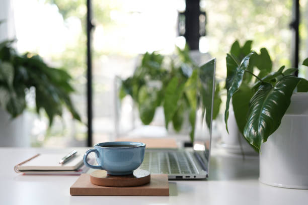 istock Laptop and Vintage cup, cozy indoor workspace 2205098762