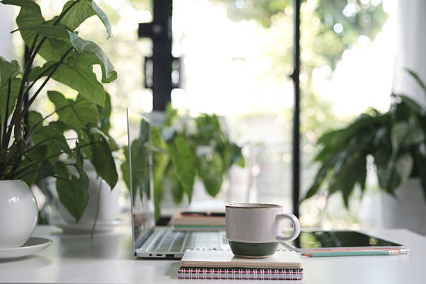istock Laptop and vintage cup, cozy indoor workspace 2205098772