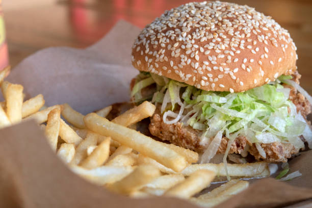 istock Chicken Sandwich with Fries Enjoyed 2205099587