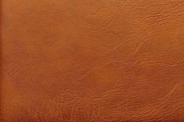 istock Macro brown synthetic leather texture,Brown pattern, design, leather fabric for sewing, dermantine, artificial leather texture background close up 2205099635