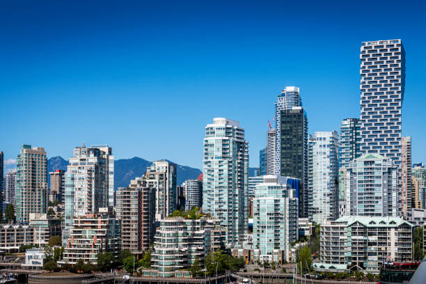 Vancouver BC cityscape skyline waterfront viewed from Granville Island. Modern buildings architecture