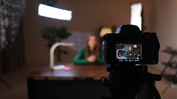 istock Engaging Conversation in a Podcast Studio With a Woman Sharing Her Insights 2205101851