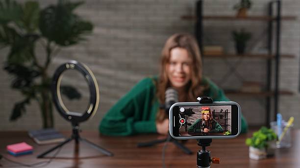 istock Engaging Conversation in a Podcast Studio With a Woman Sharing Her Insights 2205102036