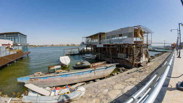 istock Waterfront with Old Boats and Dilapidated Building 2205102346