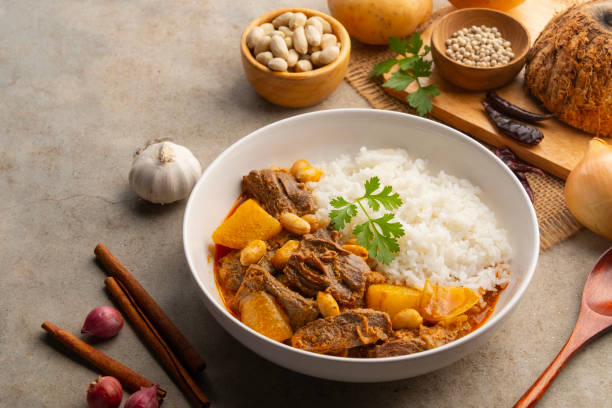 istock Massaman Curry with beef and cooked rice in white plate. 2205102838