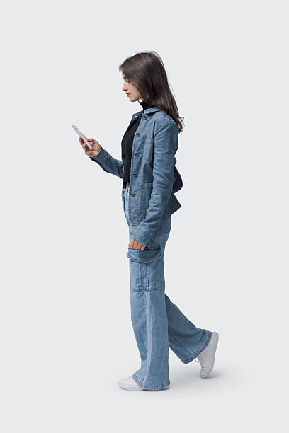 istock Young woman checking her smartphone 2205103028